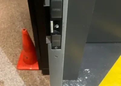 Black digital smart lock on a timber door