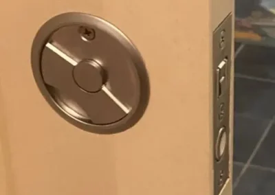 Brass deadbolt and lever handle on a glass-panel entry door