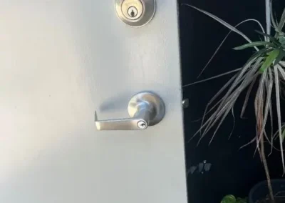 Euro cylinder and black lever handle on a grey door