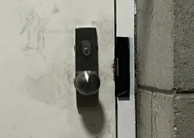 Black smart handle and digital lock on a grey door