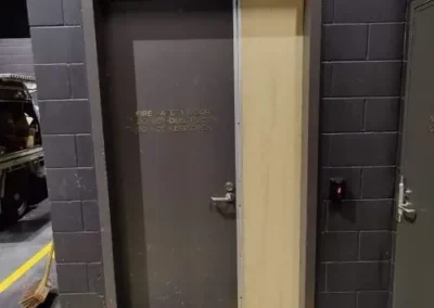 Paired grey doors with black handle and lock hardware