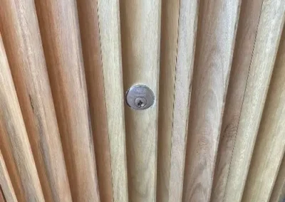 Close view of a deadbolt lock fitted to a timber door