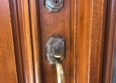 Close view of a lock cylinder on a timber door