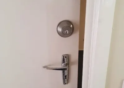 Silver lever handle and round door lock