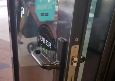Electronic access hardware fitted beside a door lock