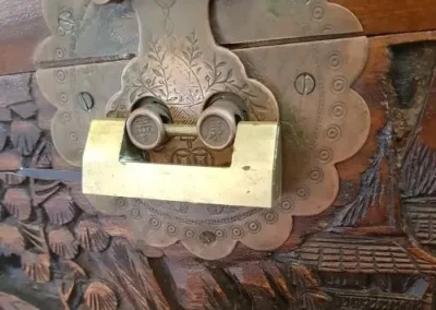 Close view of a padlock securing a metal gate