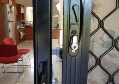 Lock hardware on a security screen door