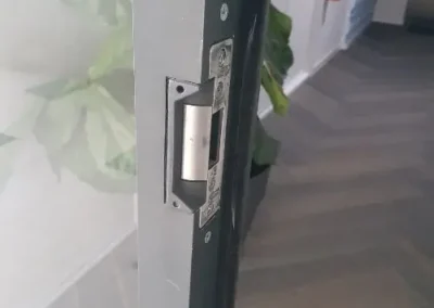 Close view of latch hardware on the edge of a door