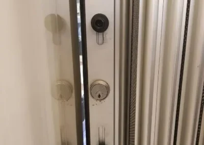 Round lock fitted to a white door