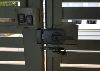 Lock and access hardware fitted to a metal gate
