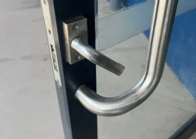 Pull handle and lock on a commercial glass door
