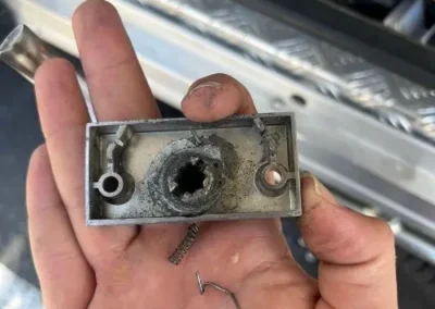 Close view of damaged lock cylinder hardware