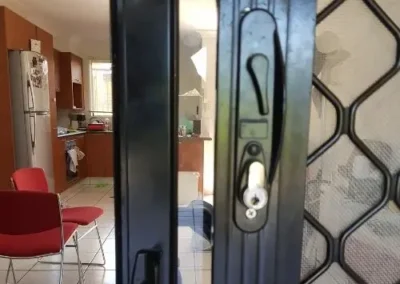 Close view of a lock on a security screen door