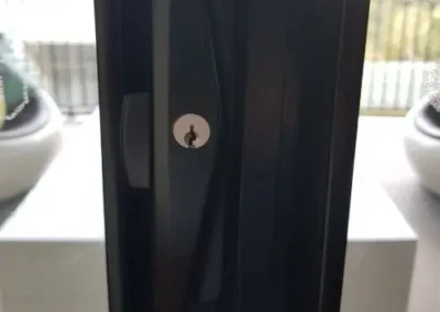 Lock cylinder fitted to a dark door frame