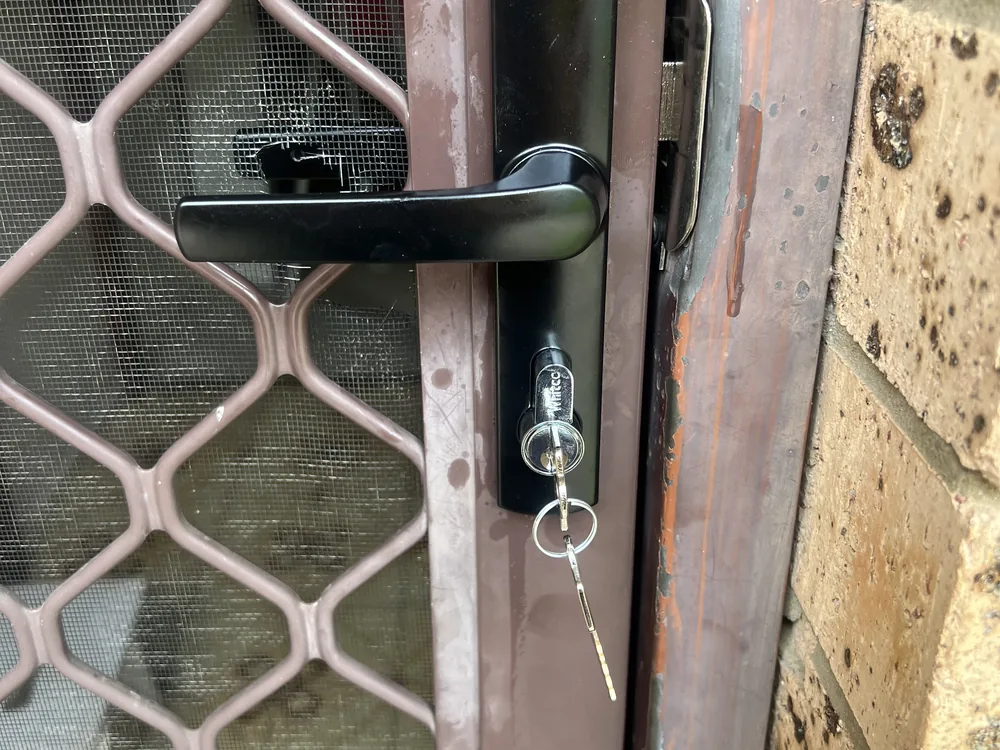 Close view of door lock and latch hardware for Keperra locksmith services