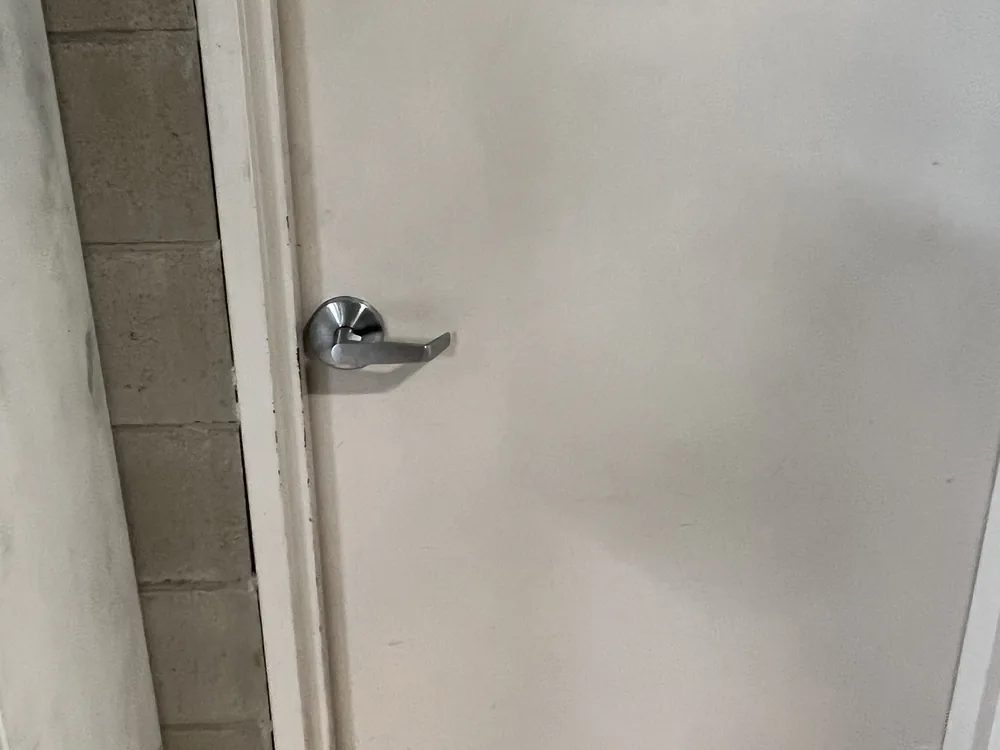 Close view of door lock and latch hardware for Nundah locksmith services